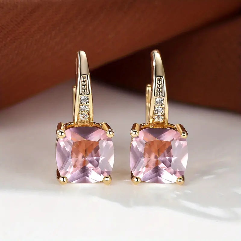 Gold hoop earrings with mystic sapphire