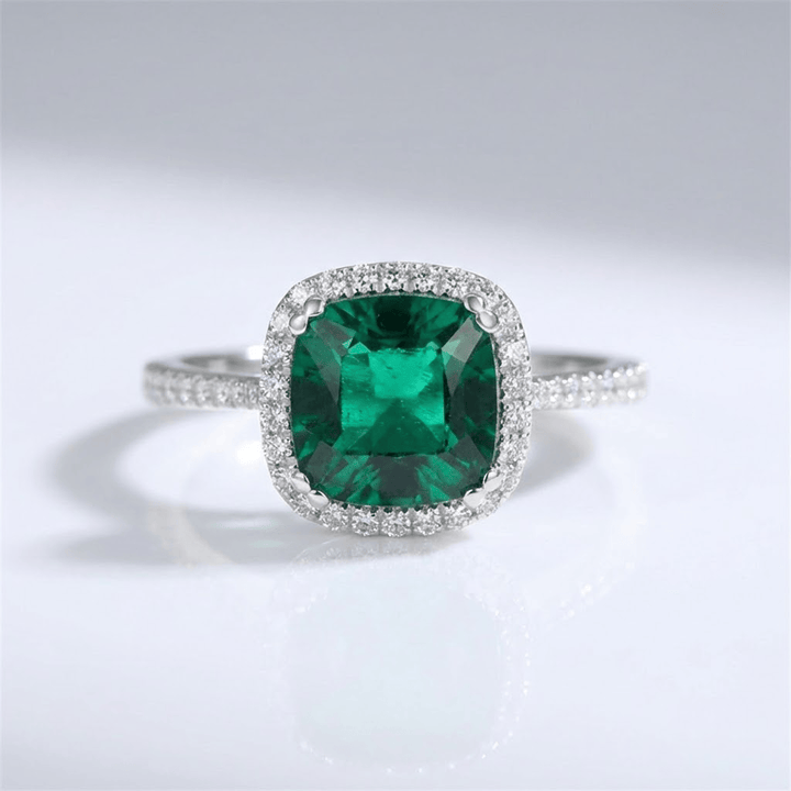 HALO RING WITH GREEN EMERALD CUSHION