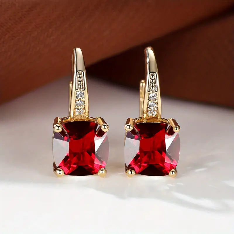 Gold hoop earrings with mystic sapphire