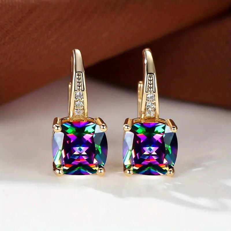 Gold hoop earrings with mystic sapphire