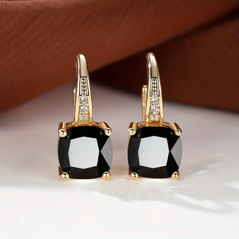 Gold hoop earrings with mystic sapphire