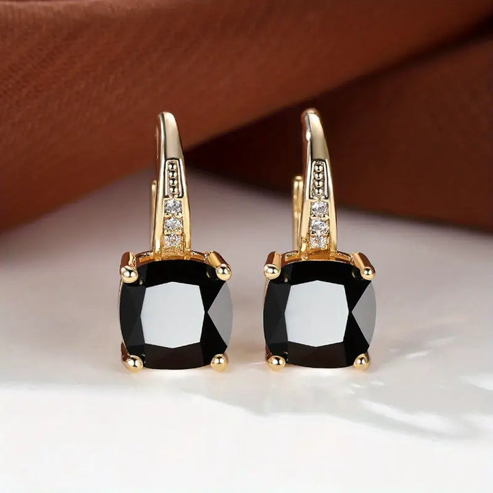 Gold hoop earrings with mystic sapphire
