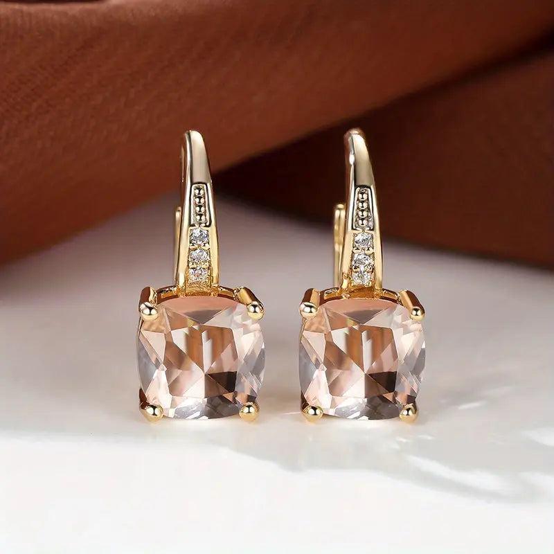 Gold hoop earrings with mystic sapphire