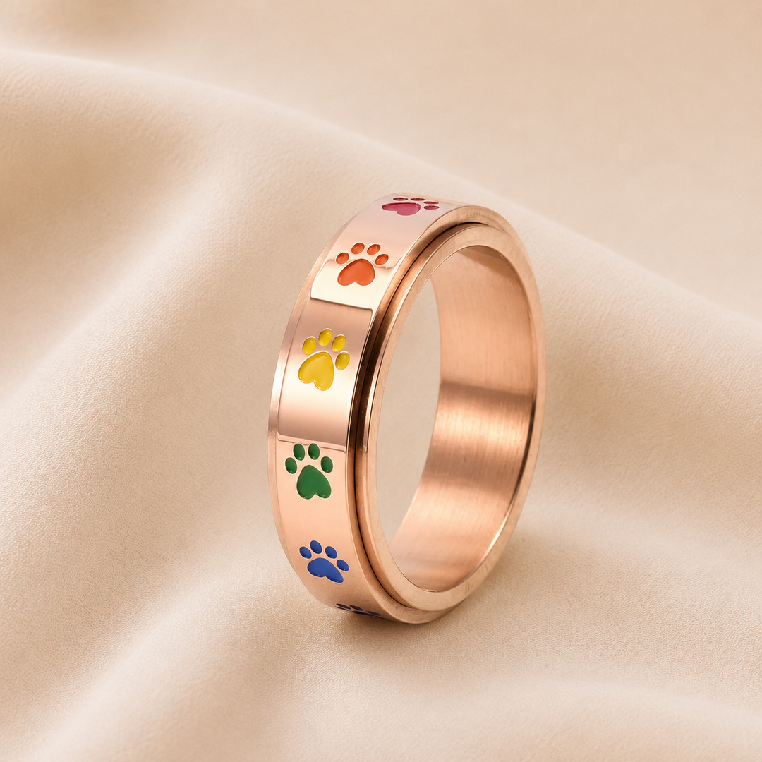 Rotating Stress Relief Ring – Stainless Steel with Rainbow Paw Prints