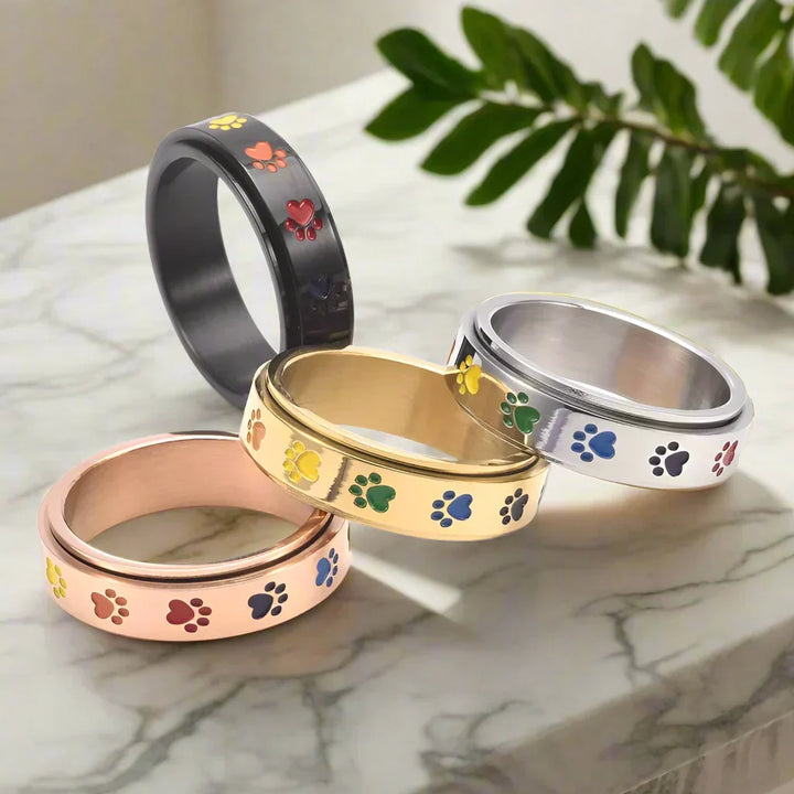 Rotating Stress Relief Ring – Stainless Steel with Rainbow Paw Prints