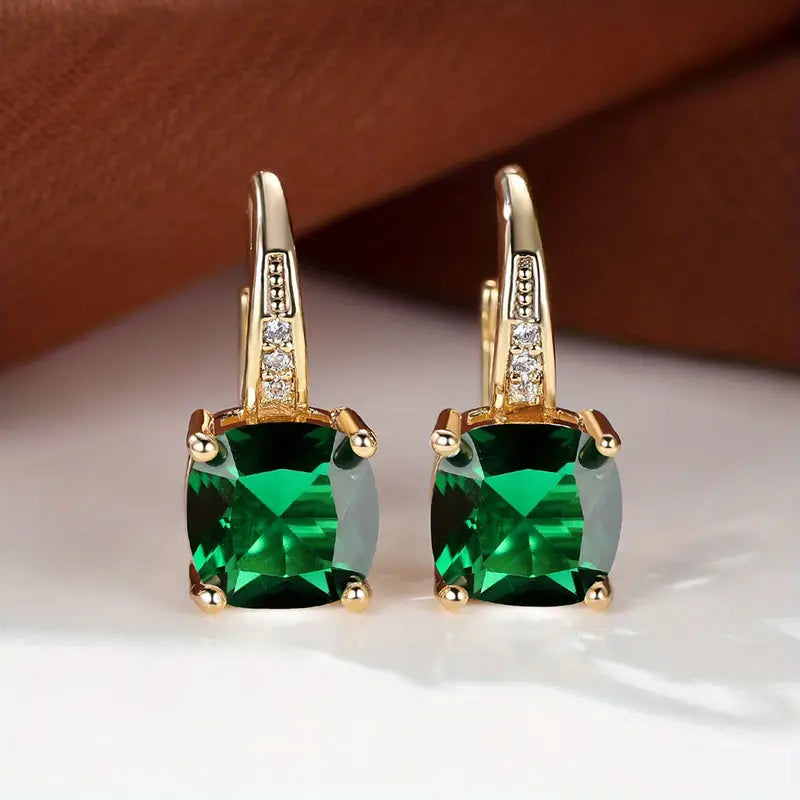 Gold hoop earrings with mystic sapphire